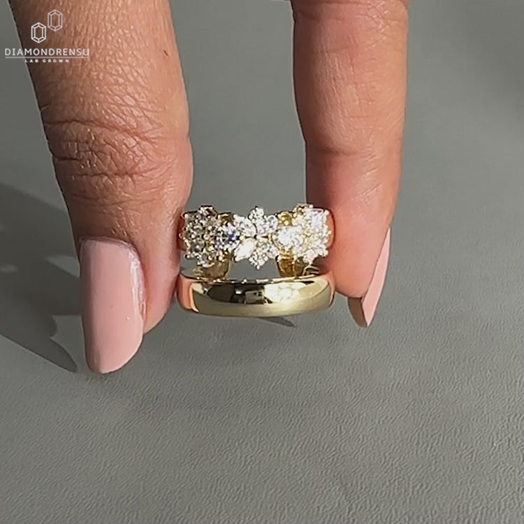 marquise and round diamond ring in open finger style.
