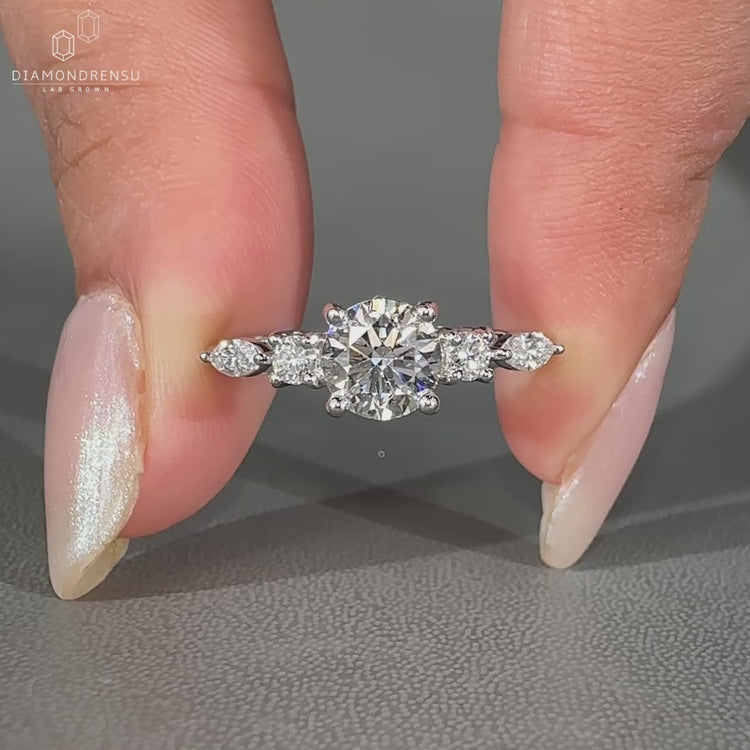 Marquise and Round Diamond Ring in white gold setting.
