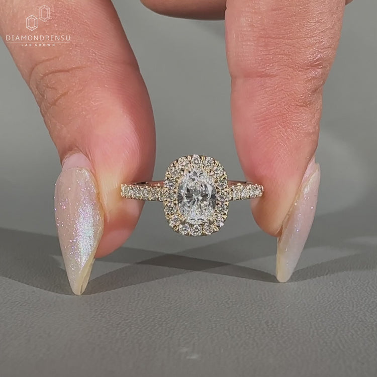 Oval Cut Diamond Ring in a yellow gold cathedral setting.
