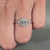 Handmade oval cut diamond ring in a cathedral pave design.
