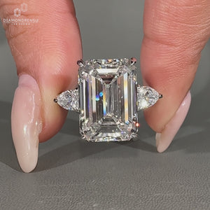 Emerald Cut Diamond Ring hidden halo with round diamonds.
