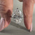 Moval diamond engagement ring in 6 claw prong setting.
