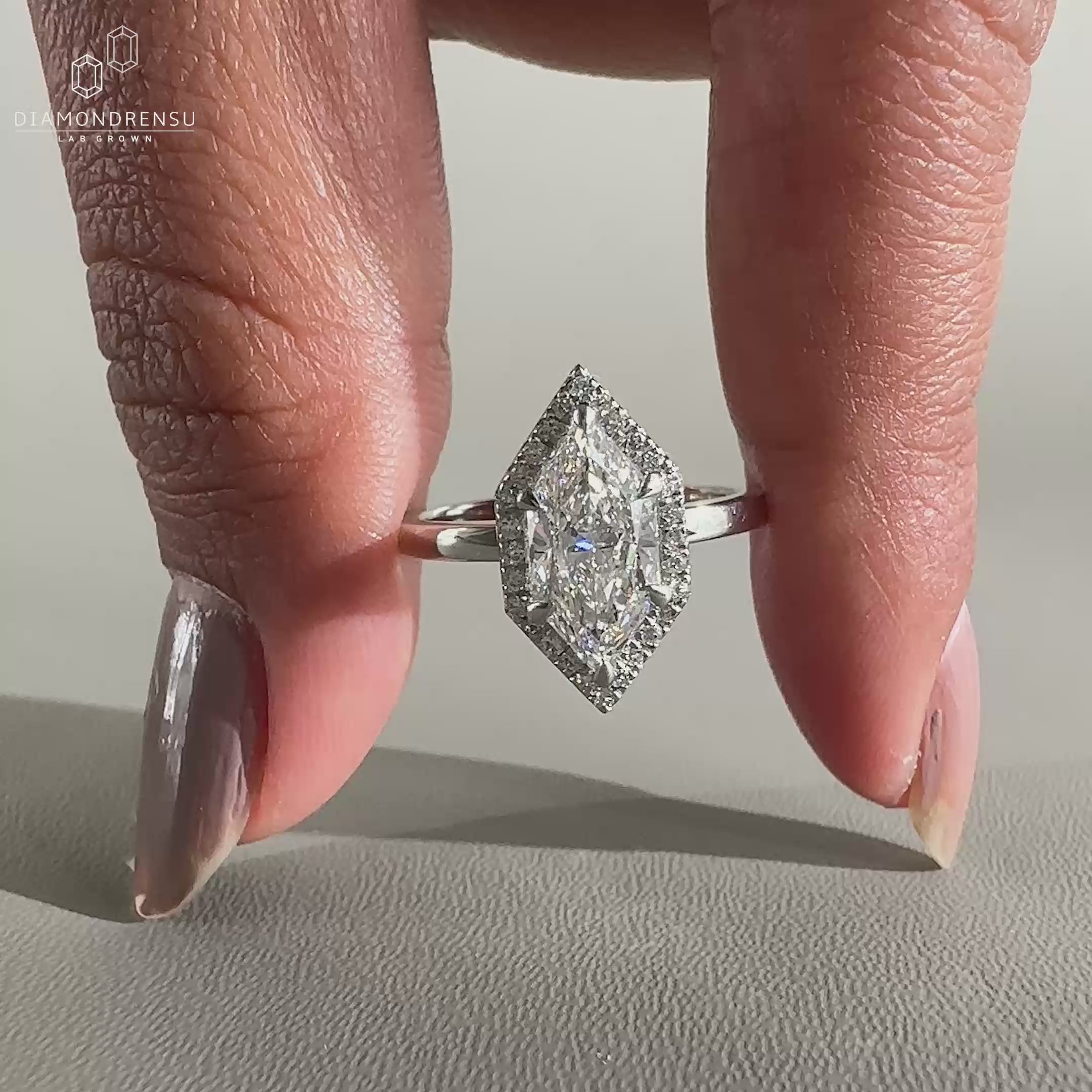 halo engagement ring in yellow gold band.
