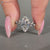 Marquise diamond ring round diamond hidden halo.