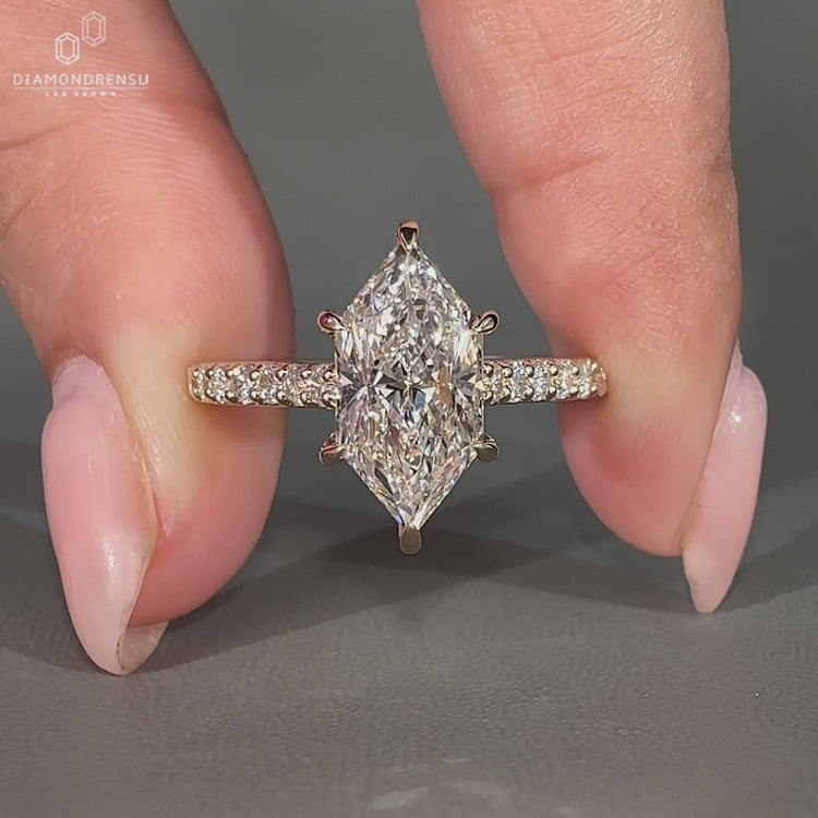 Handmade Dutch marquise diamond ring in cathedral setting.
