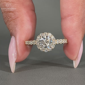 Lab grown round cut diamond ring in halo design.
