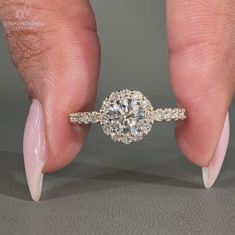 Lab grown round cut diamond ring in halo design.
