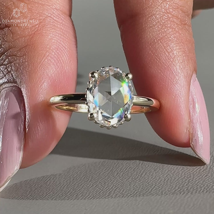Oval rose cut diamond ring in milgrain ring setting.
