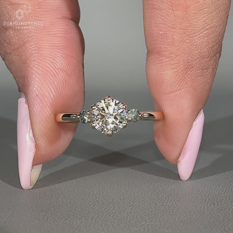 Round diamond ring moss agate three stone tapered shank.
