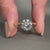 Round cut diamond ring designed in a classic yellow gold setting.
