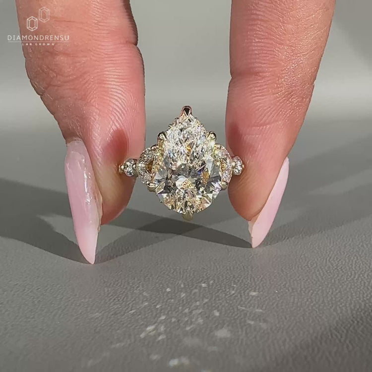 Handmade pear cut diamond ring with hidden halo setting.
