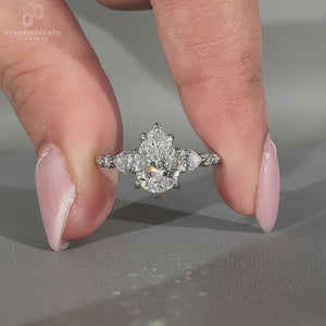 Pear diamond ring seven stone pear round stones style.
