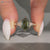 Hexagon diamond ring with three stone setting.