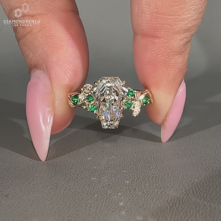 Coffin diamond ring nature inspired prong setting.