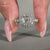 Cushion cut diamond ring with pavé diamonds and double claw prong setting.
