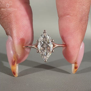 Solitaire engagement ring has a split shank ring.
