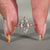 Solitaire engagement ring has a split shank ring.

