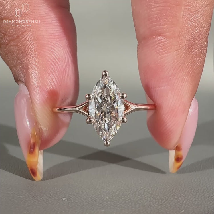Solitaire engagement ring has a split shank ring.
