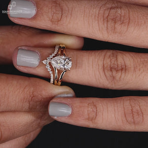 Hidden halo engagement ring set with a chevron wedding band.

