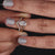 Hidden halo engagement ring set with a chevron wedding band.
