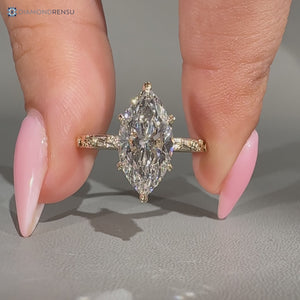 Marquise diamond ring with leaf style prongs.