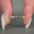 Marquise diamond band in shared prong setting.