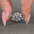 Round diamond ring with nature inspired design.