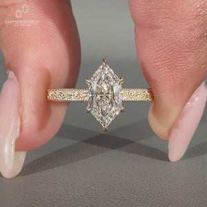 Dutch marquise ring milgrain ocean wave solitaire.