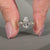 Pear diamond ring two kite stones three stone style.