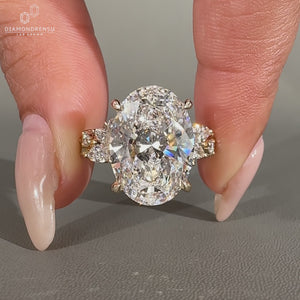 Cluster style Oval Cut Diamond Ring with side stones.
