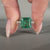 Asscher emerald ring pave band round diamond prong set.
