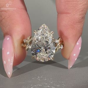 Nature inspired Pear Cut Diamond Ring cluster style.
