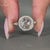 Round side stone fits in pave setting ring.
