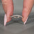 Round diamond band ocean wave half eternity design.

