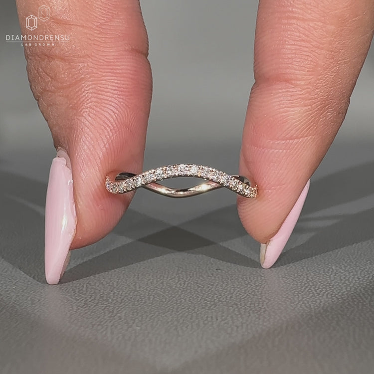 Round diamond band ocean wave half eternity design.
