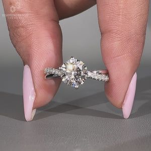 Round diamond ring twisted pave shank four prong set.
