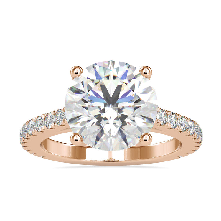 Round diamond engagement ring with a 4 prong round engagement ring style in a pave setting.
