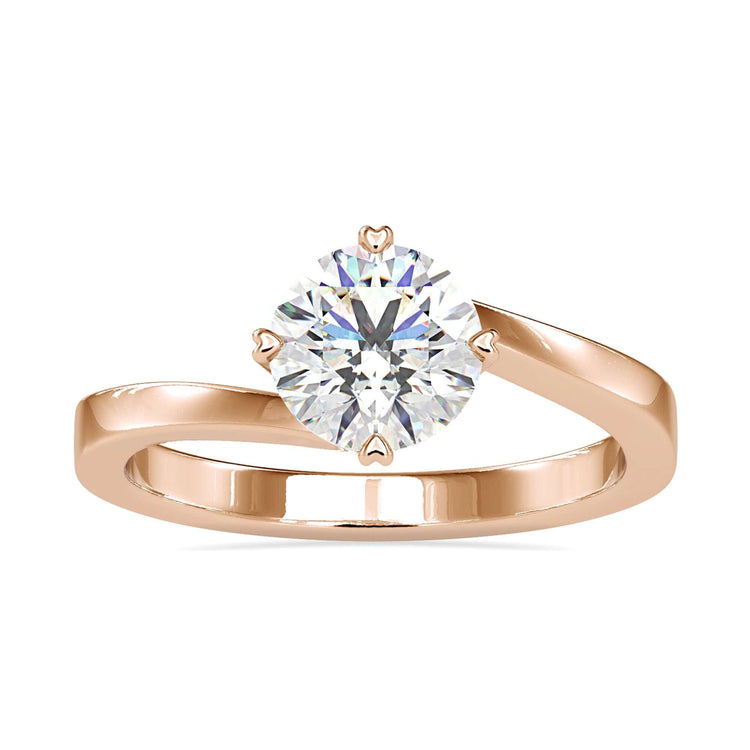 Elegant diamond solitaire ring round in a bypass design with handmade details.