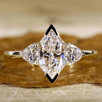 Dutch Marquise Engagement Ring with trillion engagement ring.
