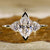 Dutch Marquise Engagement Ring with trillion engagement ring.

