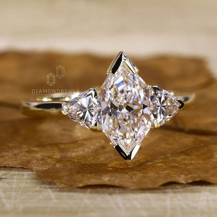 3 stone engagement ring in yellow gold.
