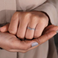 Hand model wearing a Curved Wedding Band