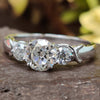 Round OEC Infinity Shank Three Stone Moissanite Engagement Ring