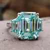 Unique 11.19 TW Emerald Cut and Trapezoid Cut Cyan Blue Three Stone Engagement Ring