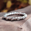 Contemporary Twisted Pave Shank Moissanite Eternity Wedding Band
